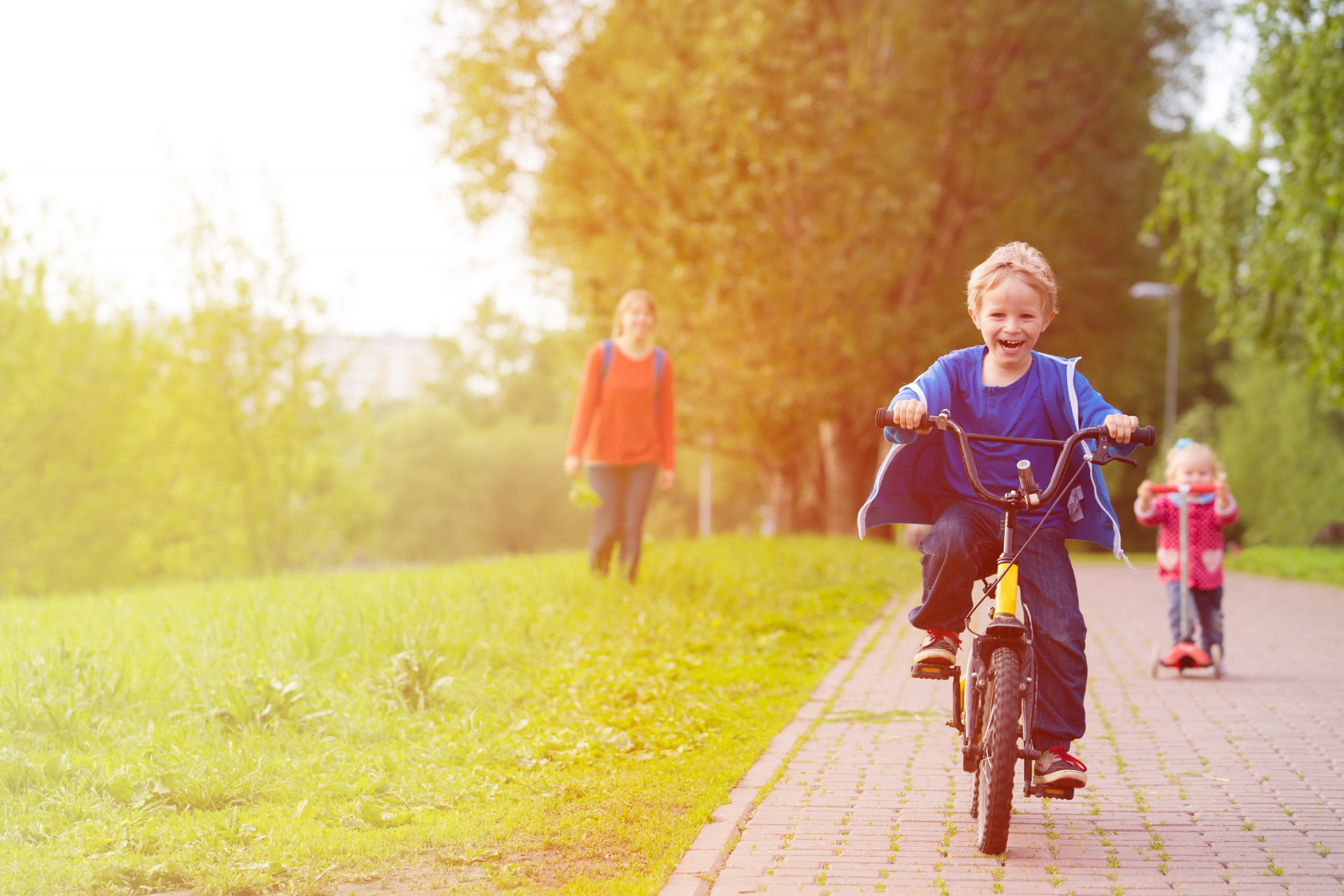 Kid enjoying outdoor activities, like riding a bike