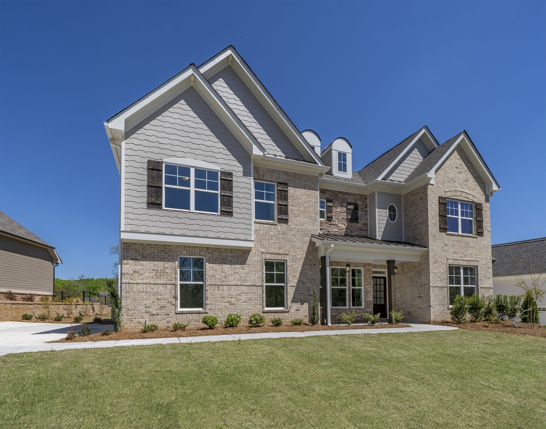 a home with a yard in traditions of braselton