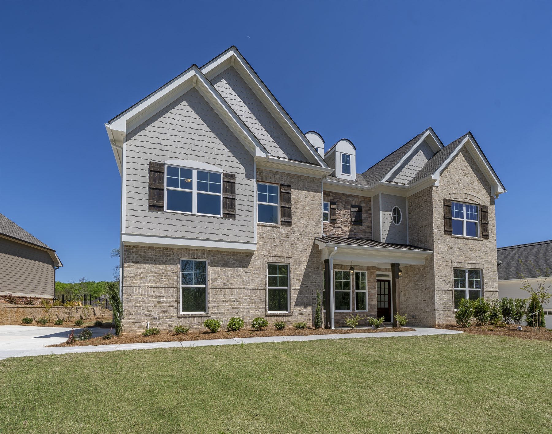 a home with a yard in traditions of braselton