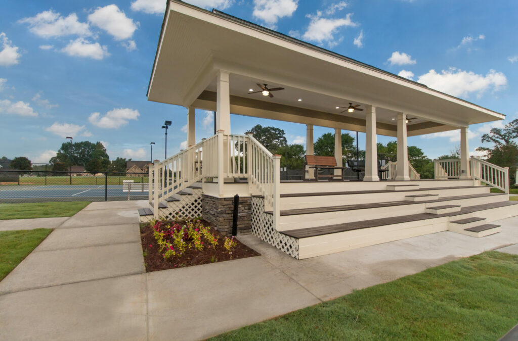 tennis courts with covered pavilions