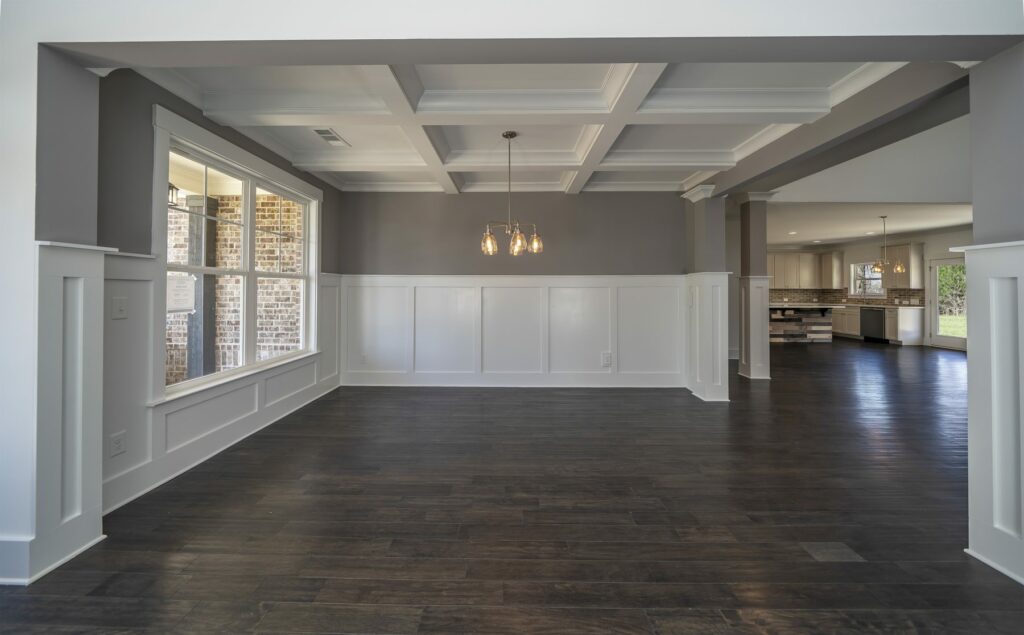 a craftsman or traditional dining room with coffered ceiling and no decor in Traditions of Braselton