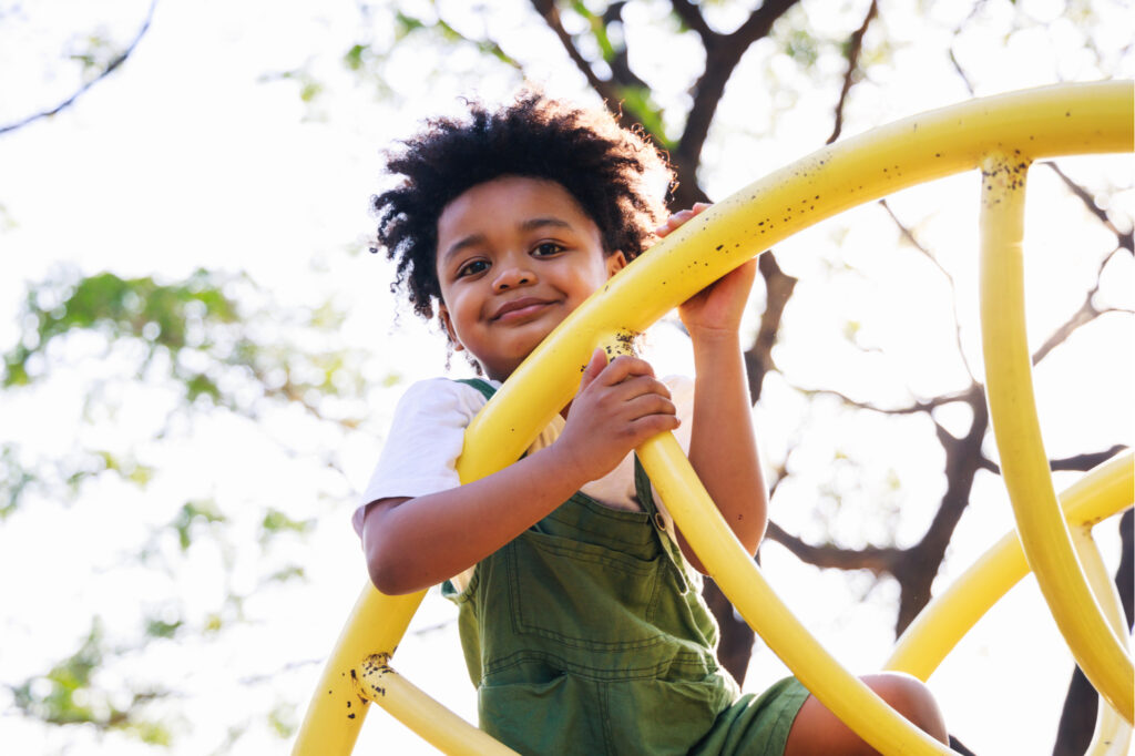 a little boy playing on jungle gym at Little Mulberry Park Chayantorn Tongmorn © Shutterstock