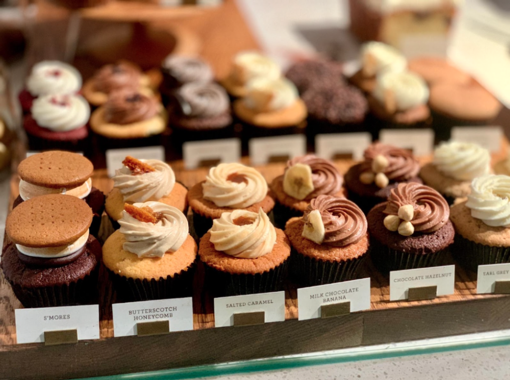 assortment of cupcakes at bakery