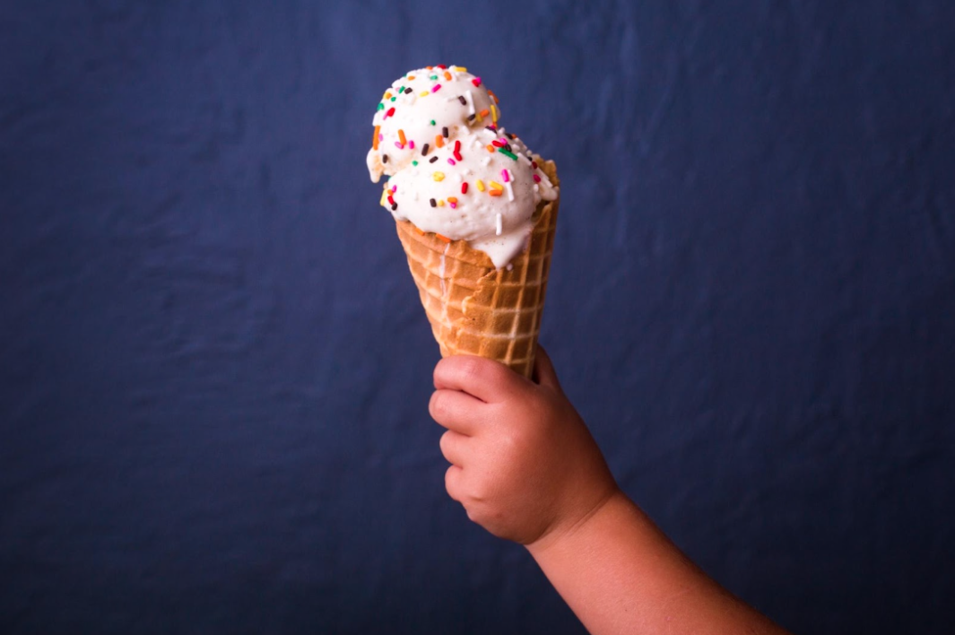 person holding ice cream cone