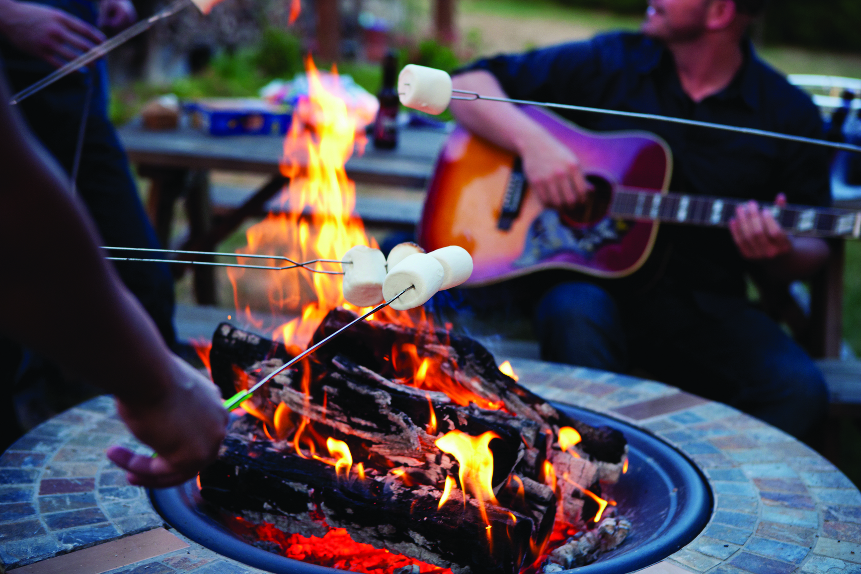 A bonfire with friends making s'mores