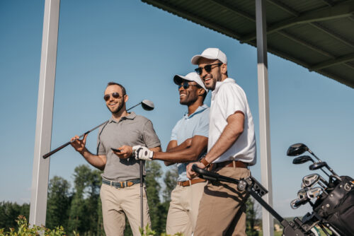 Group of men playing golf ©LightField Studios