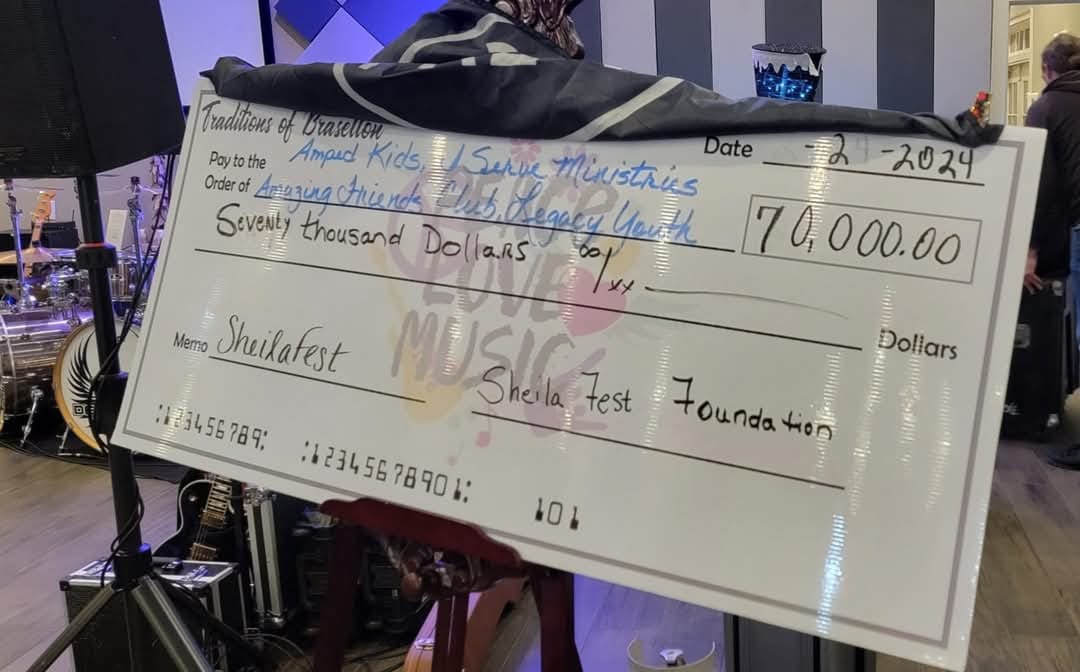 Large check from last year's Sheila Fest, showing $70,000 donated to local charities. 