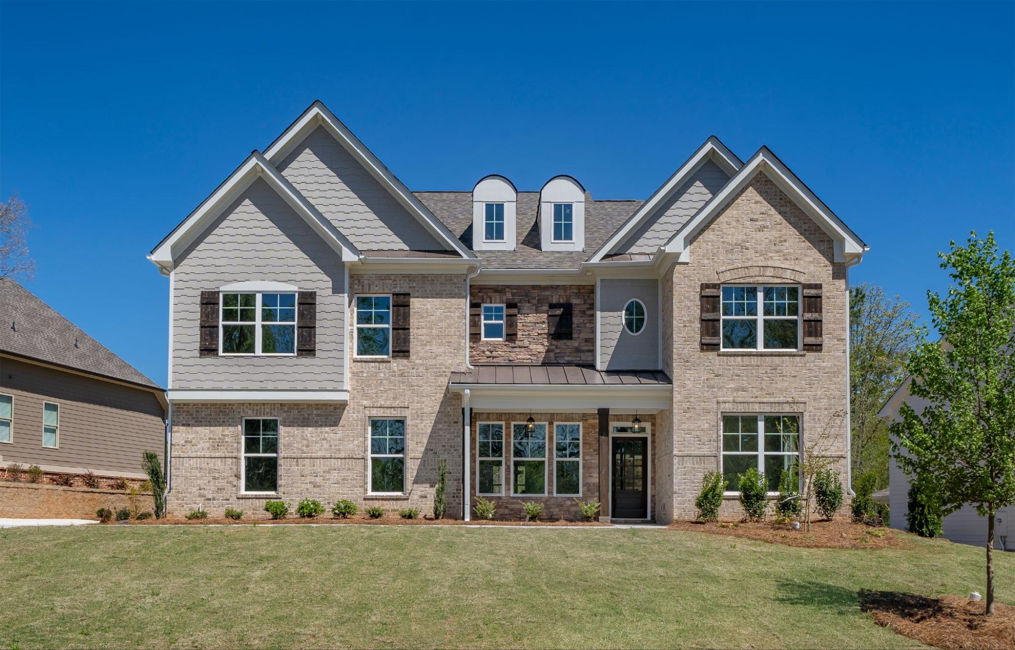 New construction home for sale with a brick facade at Traditions of Braselton.