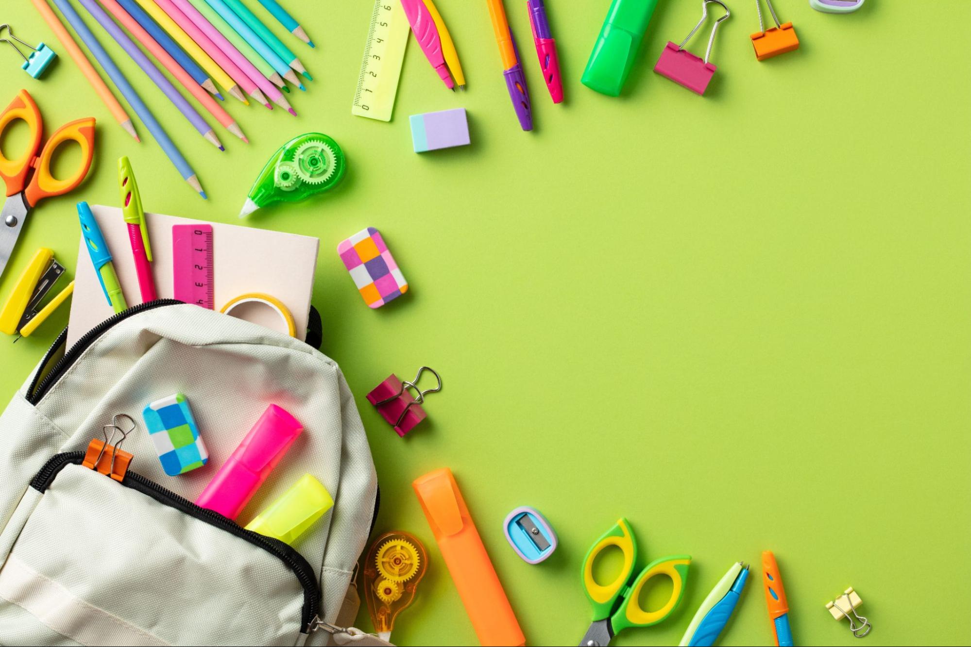 School backpack overflowing with colorful stationery and supplies for back to school 2026. ©Savanevich Viktar